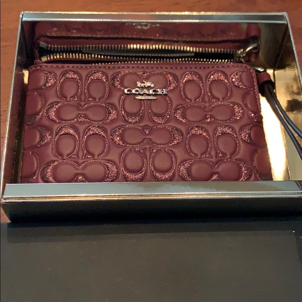 Maroon and glitter COACH wristlet
